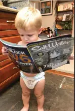  ??  ?? NEVER TOO SOON: Who says you have to know how to read to enjoy Salt Water Sportsman?