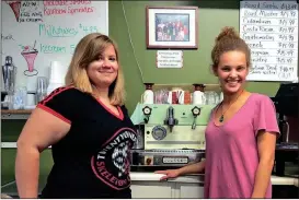  ??  ?? Autumn Woods (left) has been working at Caffeine Addicts for a year and a half and Spencer Davis for seven months. (Catoosa News photo/Tamara Wolk)