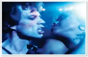  ??  ?? RAUNCHY: Jagger gets close to Rae Dawn Chong in the video for his 1985 track Just Another Night. She later complained that he was ‘licky’ on the shoot