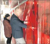  ??  ?? Prairie State College President Terri Winfree, left, and Craig Schmidt, vice president for community and economic developmen­t, view welding stations inside a new mobile training center.