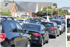  ?? ANDREW TEEBAY ?? People walking to the beach and streets full of cars at Ainsdale