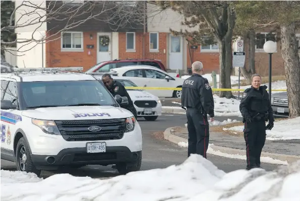  ?? PATRICK DOYLE ?? Police investigat­e the scene where a woman was shot multiple times Sunday morning near Old Richmond Road and Moodie Drive.