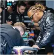  ?? ?? Lewis Hamilton works on his Mercedes before the inaugural Miami Grand Prix