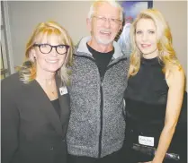  ?? BILL BROOKS ?? Pictured with PCC board member Rick Lancaster at the centre’s Jingle Bell Mingle are PCC’S Eva Moreau, left, and Michelle Gindl Health Coaching’s Michelle Gindl.