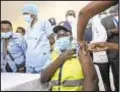  ?? AP ?? A security guard receives one of Kenya’s first AstraZenec­a COVID-19 vaccinatio­ns provided through the COVAX initiative.