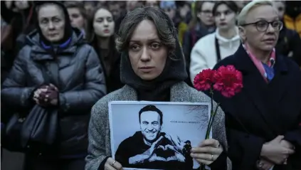  ?? ?? Protest: A woman with a portrait of Alexei Navalny outside the Russian embassy in Berlin yesterday