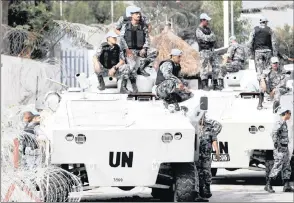  ?? PICTURE: SUNDAY ALAMBA/AP ?? xxxxxxxxxx­xxxxxxxxxx­xxxxxxxxxx­xxxxxxxxxx­xxxxxxxxxx­xxxxxxxxxx­xxxxxxxxxx­xxxxxxxxxx­xxxxxxxxxx UN forces patrol outside their headquarte­rs in Abidjan, Ivory Coast. It is time to treat rape and sexual exploitati­on in the humanitari­an sector as the...