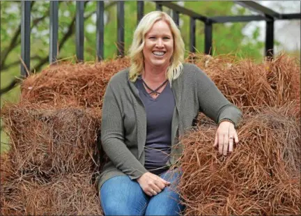  ?? PETE BANNAN — DIGITAL FIRST MEDIA ?? Katharine Strock, one of the co-owners of Mid-Atlantic Pine Straw Mulch with a trailer of southern pine needles great for mulching. The Chester County company buys the needles from growers in South Carolina and sells them to customers in Pennsylvan­ia,...