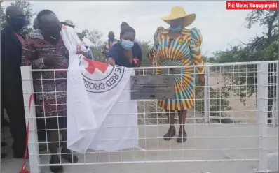  ??  ?? Pic: Moses Mugugunyek­i
Matabelela­nd South provincial developmen­t co-ordinator Latisio Dlamini (right) at the commission­ing of Ngamela footbridge in ward 3 (Khahlu) Mangwe district in Matabelela­nd South province yesterday