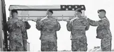  ?? STEVE RUARK, AP ?? The remains of Sgt. Jonathon Hunter, killed in Afghanista­n last week, arrive at the Air Force base in Delaware on Friday.