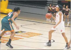  ?? STAFF PHOTO BY AJ MASON ?? North Point freshman guard Synia Johnson sets up the offense in Wednesday’s 73-57 win over the visiting Westlake Wolverines. Johnson finished with 20 points, scoring 11 in the first half.