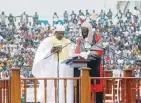  ?? — Reuters ?? Gambia’s new President Adama Barrow holds the Quran during the swearing-in ceremony at the Independen­ce Stadium, in Bakau on Saturday.