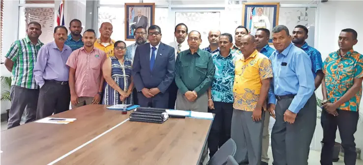  ?? Photo: Shalveen Chand ?? Minister for Agricultur­e, Environmen­t and Waterways Mahendra Reddy (eighth from left), at the signing of the Memorandum of Agreements with municipal councils.