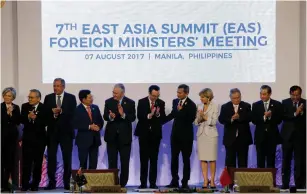  ?? (Reuters) ?? POLITICAL LEADERS gather for a group photo at the start of the 7th East Asia Summit Foreign Ministers’ Meeting in Manila, Philippine­s on Sunday.