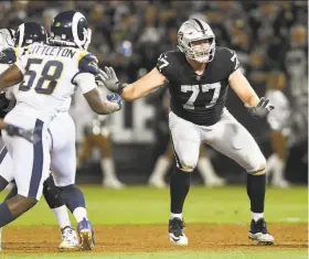  ?? Thearon W. Henderson / Getty Images 2018 ?? Kolton Miller, shown against the Rams in September, was a first-round pick of the Raiders last season. Jon Gruden plans to keep Miller at left tackle.
