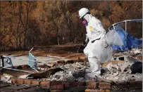  ?? Guy Mccarthy
/ Union Democrat ?? Workers from a Sacramento company have been contracted by the state Department of Toxic Substances Control to complete a first phase of hazardous household debris cleanup on about a dozen parcels where 19 structures burned in the Aug. 26 Washington Fire (above and top).