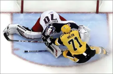  ?? GENE J. PUSKAR - THE ASSOCIATED PRESS ?? Pittsburgh Penguins’ Evgeni Malkin (71) can’t get a shot past Columbus Blue Jackets goaltender Joonas Korpisalo during the second period of an NHL hockey game in Pittsburgh, Thursday, March 7, 2019. The Penguins won 3-0.