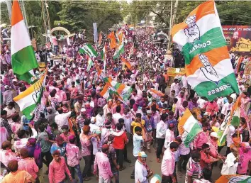  ?? PTI ?? Congress party workers celebrate after party candidate Anand Siddu Nyamagouda defeated his BJP rival Srikant Kulkarni in the Jamkhandi assembly by-election yesterday.