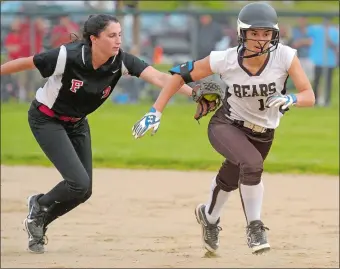  ?? TIM COOK/THE DAY ?? Stonington’s Abby Blanchard gets tagged out in a rundown by Fitch second baseman Nicole Vignato, left, in the first inning of Wednesday’s ECC softball tournament semifinal at Griswold. Blanchard’s teammate Mallory Kane was able to score on the play....