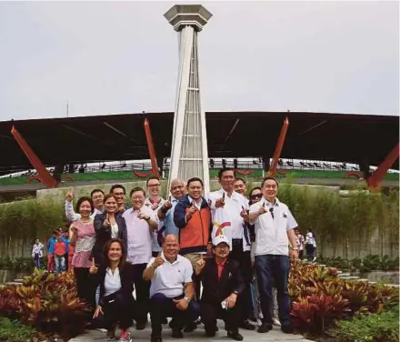  ?? AFP PIC ?? Government officials with Philippine Sea Games Organising Committee chairman Alan Cayetano (back centre) at the cauldron tower in New Clark City recently.