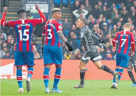  ?? Picture: Getty Images. ?? Jamie Vardy in celebratio­n mode after netting Leicester’s second goal at Crystal Palace.