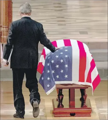  ?? Andrew Harnik Pool Photo ?? GEORGE W. BUSH prepares to eulogize his father. Many wept as he recalled their final phone conversati­on.