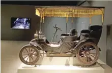  ??  ?? A 1901 Duryea Surrey is shown during the unveiling of the exhibition.