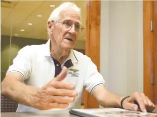  ?? STAFF PHOTO BY ROBIN RUDD ?? Ron Gracy, a former Catoosa County commission­er, discusses his autobiogra­phy Monday about his career as a Navy pilot.