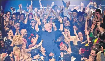  ?? — AFP photo ?? Gaultier (centre) celebrates with models at the end of his Women’s Spring-Summer 2020 Haute Couture collection fashion show in Paris.