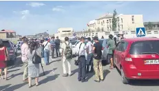  ?? XINHUA VIA AP ?? People gather near an explosion site in Bishkek, Kyrgyzstan, yesterday.