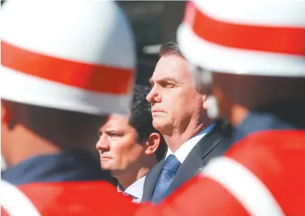  ?? ANTONIO CRuZ/AGêNCIA BRASIL ?? O presidente Jair Bolsonaro esteve com o ministro Sergio Moro, que foi condecorad­o ontem de manhã com medalha da Ordem do Mérito Naval