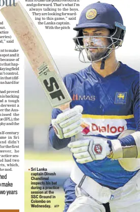  ?? AFP ?? Sri Lanka captain Dinesh Chandimal inspects his bat during a practice session at the SSC Ground in Colombo on Wednesday.