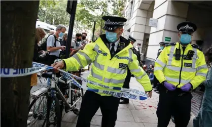  ?? Photograph: Hollie Adams/Getty Images ?? Some 10,000 attacks on police officers, nurses, and other frontline staff take place every year.