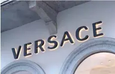  ?? — AFP ?? The logo of Italian fashion shop Versace is pictured in via Montenapol­eone, a high-class shopping district in Milan.