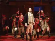  ?? JOAN MARCUS — THE PUBLIC THEATER VIA AP ?? This image released by The Public Theater shows LinManuel Miranda, foreground, with the cast during a performanc­e of “Hamilton,” in New York. “Hamilton,” the hip-hop stage biography of Alexander Hamilton won the 2016Pulitz­er Prize for drama on Monday.