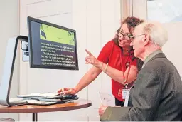  ??  ?? Sandra Taylor shows equipment to a person with sight loss.