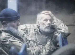  ?? PHOTO: REUTERS ?? Prisoners of war . . . Service members of the Ukrainian armed forces, who surrendere­d at the besieged Azovstal steel mill in Mariupol in the course of the UkraineRus­sia conflict, sit in a bus upon their arrival under escort of the proRussian military in the settlement of Olenivka in the Donetsk region, Ukraine, yesterday.