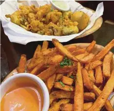  ??  ?? Sweet potato fries are a highly-recommende­d starter at Royz et Vous.