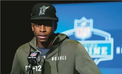  ?? MICHAEL CONROY/AP ?? Mississipp­i State cornerback Emmanuel Forbes spoke about his conversati­ons with the Dolphins while wearing a Florida Marlins hat Thursday at a news conference at the NFL combine in Indianapol­is.