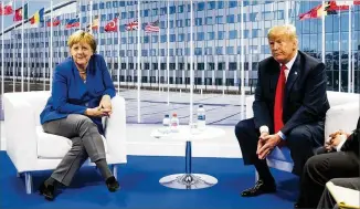  ?? DOUG MILLS / THE NEW YORK TIMES ?? President Donald Trump meets Wednesday with German Chancellor Angela Merkel at NATO headquarte­rs in Brussels, where he criticized Germany and allies. other