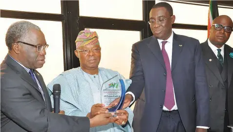  ?? PHOTO: FEMI ADEBESIN-KUTI ?? Director, Nigeria-south Africa Chamber of Commerce, Dr. Edun Sonaiya (left); Life Patron, Dr. Oba Otudeko; Directors, Osayaba Giwa-osagie and Ubong King at the chamber’s breakfast meeting sponsored by Protection Plus Services Limited in Lagos…yesterday