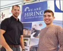  ?? STEVE MacNAULL/The Daily Courier ?? Emil Anderson Constructi­on project manager Kyle Anderson, left, spoke with job-seeking civil engineer Luis Ayala at Wednesday’s Business Exposition & Employment Fair at the Kelowna campus of Okanagan College.