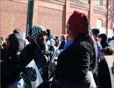  ?? Diane Wagner / RN-T ?? Wearing knit caps to ward off the chill, Yolanda Ware (left) and Bentson McKnight line up Monday for the annual Freedom March they’ve been participat­ing in for three decades in honor of Martin Luther King Jr. Day.