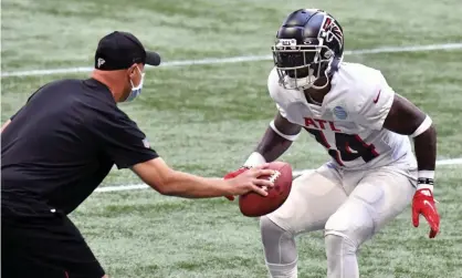  ??  ?? Atlanta Falcons safety Chris Cooper (34) runs a drill during training. Photograph: Hyosub Shin/AP