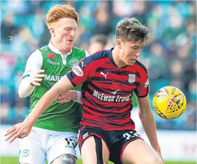  ?? Picture: SNS Group. ?? Simon Murray, who has joined Dundee on loan from Hibs, and Jack Hendry, who has left Dundee for Celtic, in action last November.