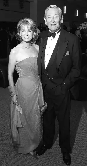  ?? Peter J. Thompson / National Post ?? Latham Burns of Nesbitt Burns and his wife, Paddy Ann, at The Carlu
events centre opening gala in Toronto in 2003.