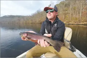  ?? ?? Rasnick shows a fine Lake Taneycomo rainbow trout.