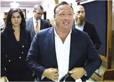  ?? Tamir Kalifa/Austin American-Statesman via AP, File ?? ■ “Infowars” host Alex Jones arrives April 17, 2017, at the Travis County Courthouse in Austin. Jones filed a motion Friday to dismiss a defamation lawsuit filed by families of some of the 26 people killed in the 2012 Sandy Hook school shooting in...