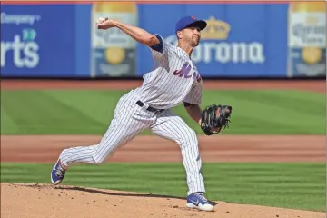  ?? USA Today Sports - Vincent Carchietta ?? Above: Making just his second start of the season, two-time Cy Young Award winner Jacob degrom was perfect into the sixth inning Sunday as the Mets won for the fourth time in their five-game series with the Braves.