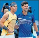  ??  ?? Nadal y Djokovic, antes de jugar.